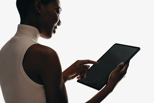 Person using a digital tablet for work or personal tasks