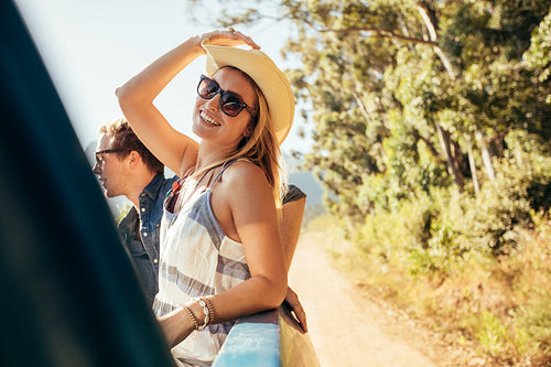 Attractive woman in the back of truck with friends