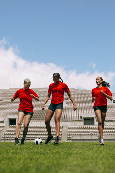 Female football team training in the field