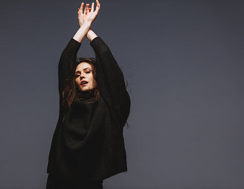 Stylish female fashion model in black