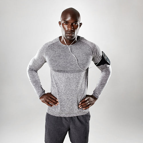 Handsome young african posing on grey background