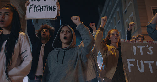 Group of demonstrators on road at night