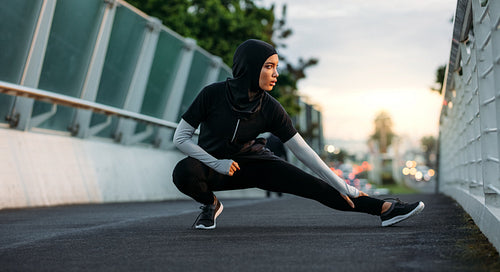 Hijab girl exercising outdoors in early morning