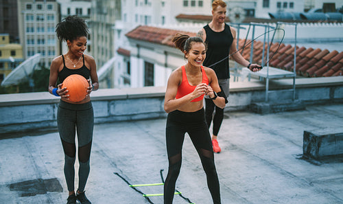 Fitness people doing workout on rooftop