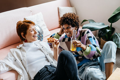 Freelance colleagues sharing a casual moment on the sofa