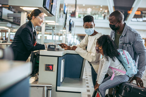 Traveler family at airport check-in counter