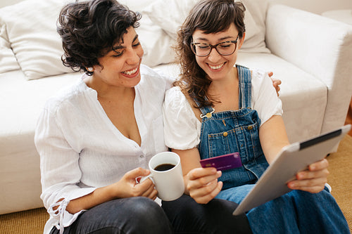 Lesbian couple doing online shopping from home