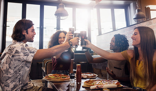 Diverse friends enjoying a meal together