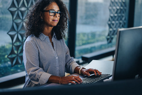 Mature businesswoman working at her office desk