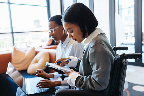 Young professionals working together on a creative project in a modern office