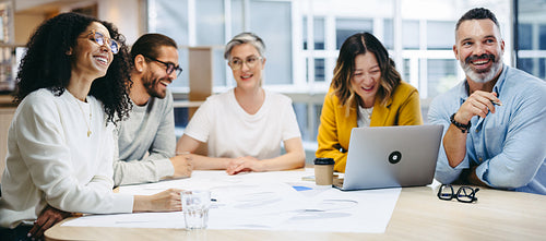 Cheerful design professionals having a meeting in an office