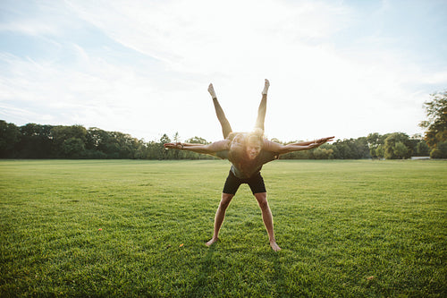 Healthy couple doing acrobatic workout