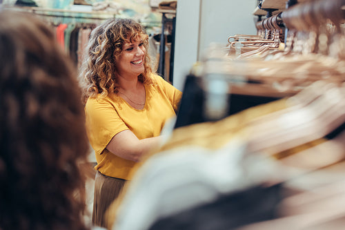 Smiling shopper in fashion store