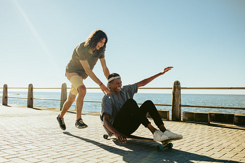 Boys enjoying outdoors on seaside road