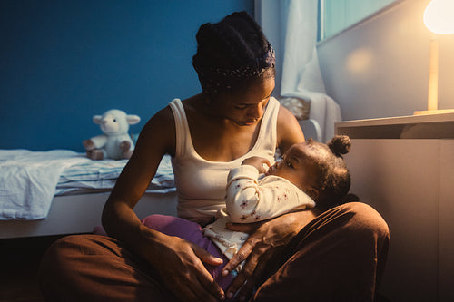 Mother comforting her child at home