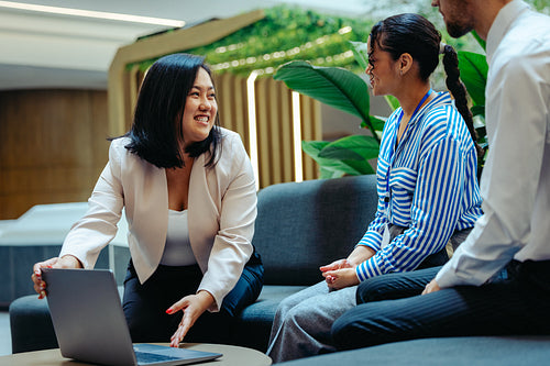 Chinese businesswoman leading a collaborative team meeting