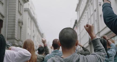 Group of protestors marching on the road