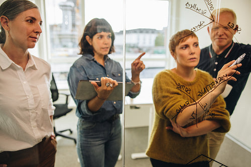 Businesswoman putting forward her ideas in meeting