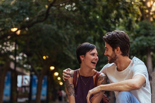 Tourist couple sitting outdoors
