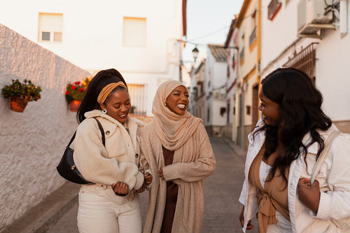 Carefree female friends laughing together outdoors