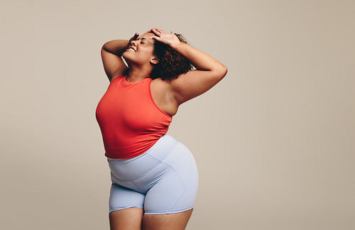 Expressive dance workout: Curvy woman enjoying moving her body