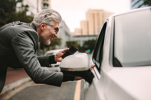 Male traveler communicating with cab driver
