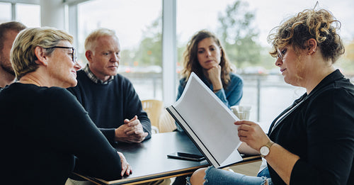 Business team discussing over an agreement in meeting