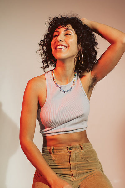 Confident young woman embracing her natural underarm hair