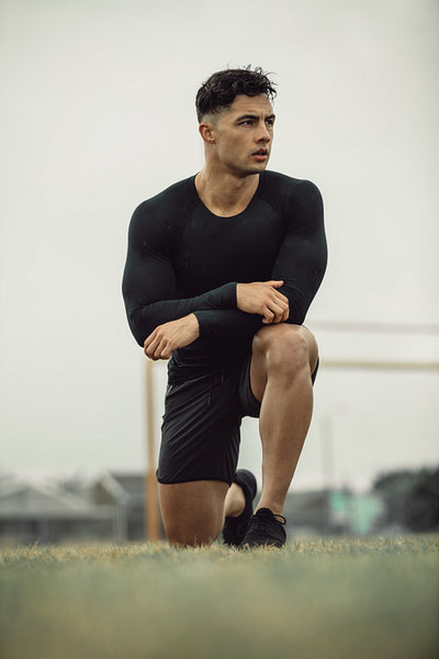 Athlete resting during morning workout on field
