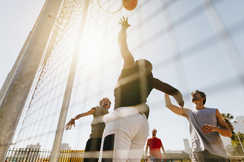 Men playing basketball