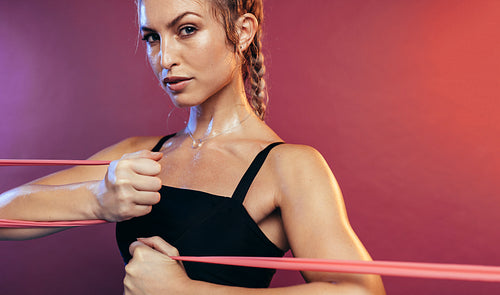 Woman working out with resistance bands