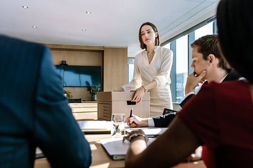 Business professionals brainstorming in office board room