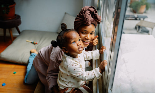 Mother and child observing outdoors
