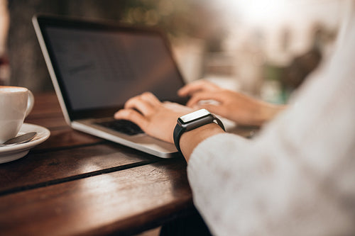 Woman hands working on laptop