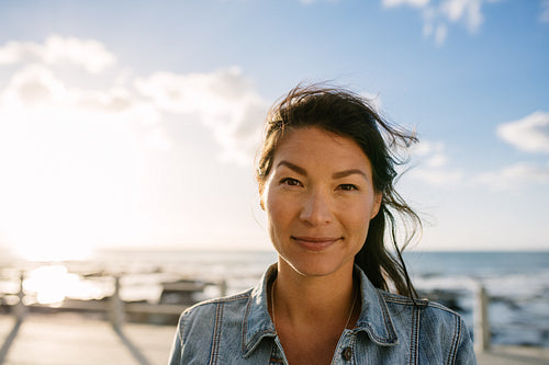Woman on vacation standing near the sea