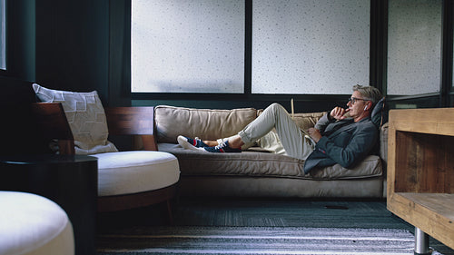 Mature man making a video call in office