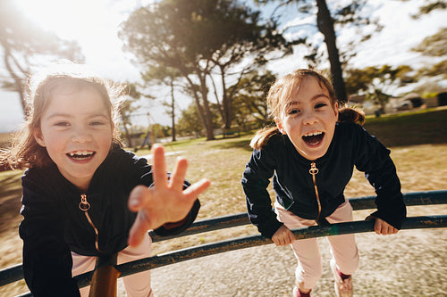 Identical twins having fun in playground