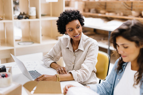 Online store owners working together in their warehouse