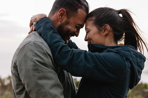 Romantic young couple standing together outdoor