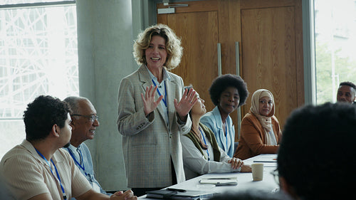 Professional woman presents to engaged audience