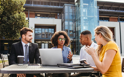 Group of business people at cafe discussing new project