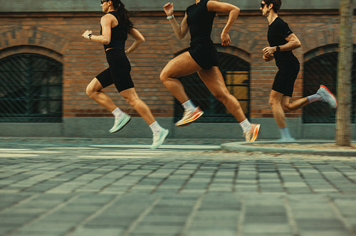 People running together through the city in a club workout