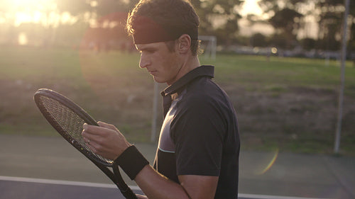 Tennis player on the hard court