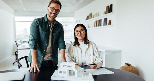 Young architects working on a house project in an office