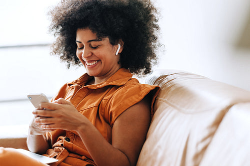 Cheerful young businesswoman having a video call on a smartphone
