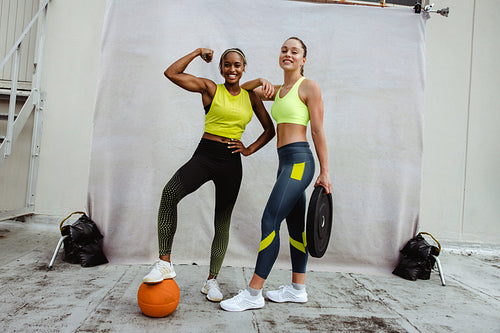 Woman posing after physical training session on rooftop