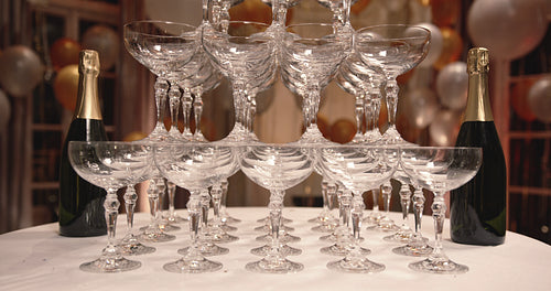 Glasses of champagne stacked in a pyramid shape