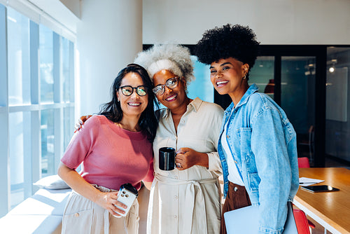 Business colleagues pause for a friendly team moment
