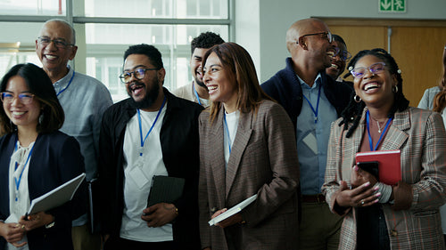Happy diverse team smiling at conference