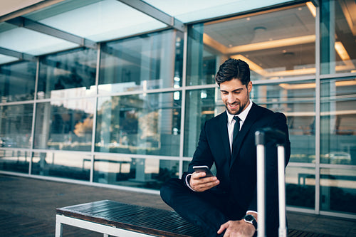 Caucasian businessman waiting in airport terminal